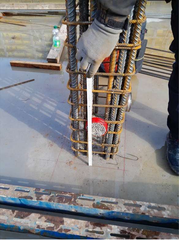 Rebar for vertical column with corrosion (forward) and moister (right) sensors attached